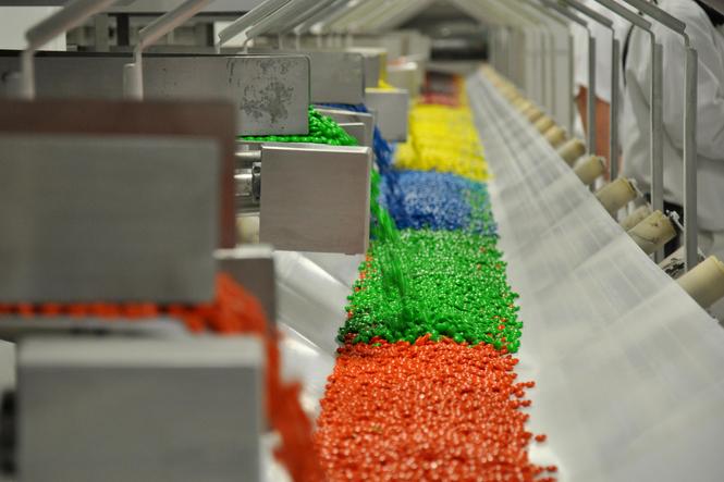 Colorful candy manufacturing photo. Article highlights news about manufacturing in the U.S.